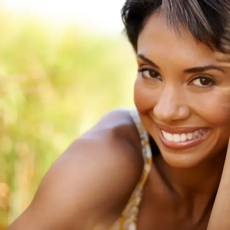 smiling woman after tmj botox treatment for jaw tension relief thanks to Chelsea Hughes aesthetic botox treatments for TMJ in calgary, ab